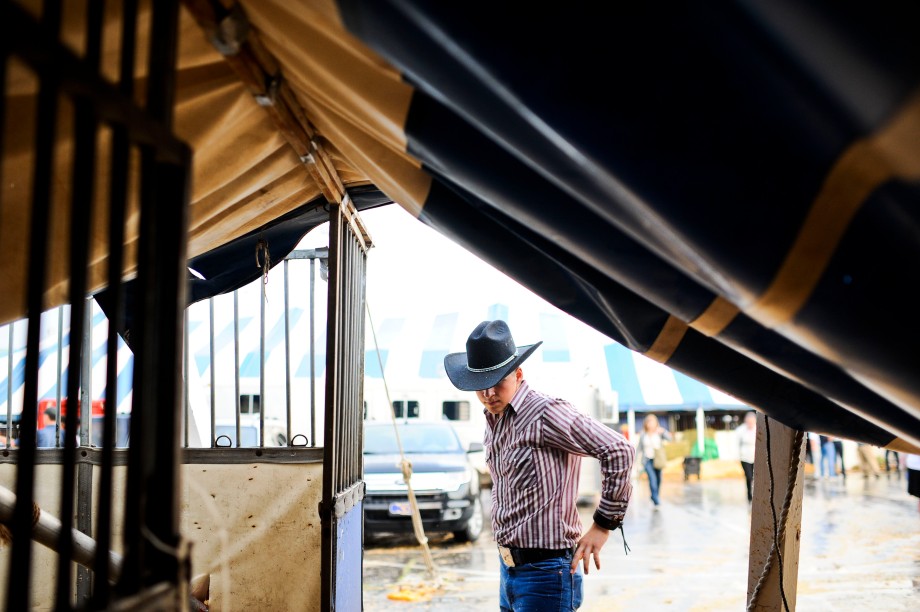 SAM OWENS | The Roanoke Times;  A young guy checks out the damaged tents that fell due to  a summer storm that passed through the Salem Civic Center where the annual Horse Show is held every year in Salem, Virginia, June 19, 2013.